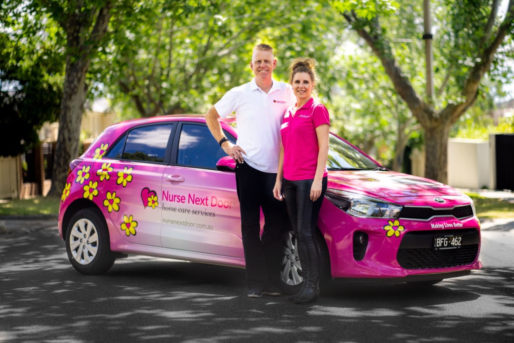 CEO & COO of Nurse Next Door with their car