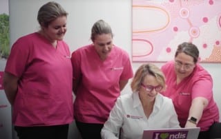 Fiona - Nurse Next Door Brisbane Franchise Partner in her office with care team