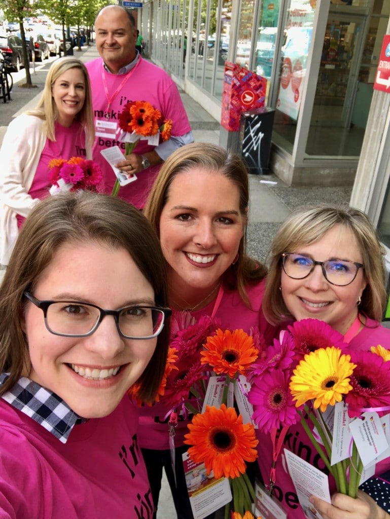 Nurse Next Door caregivers out on the streets handing out flowers as acts of kindess