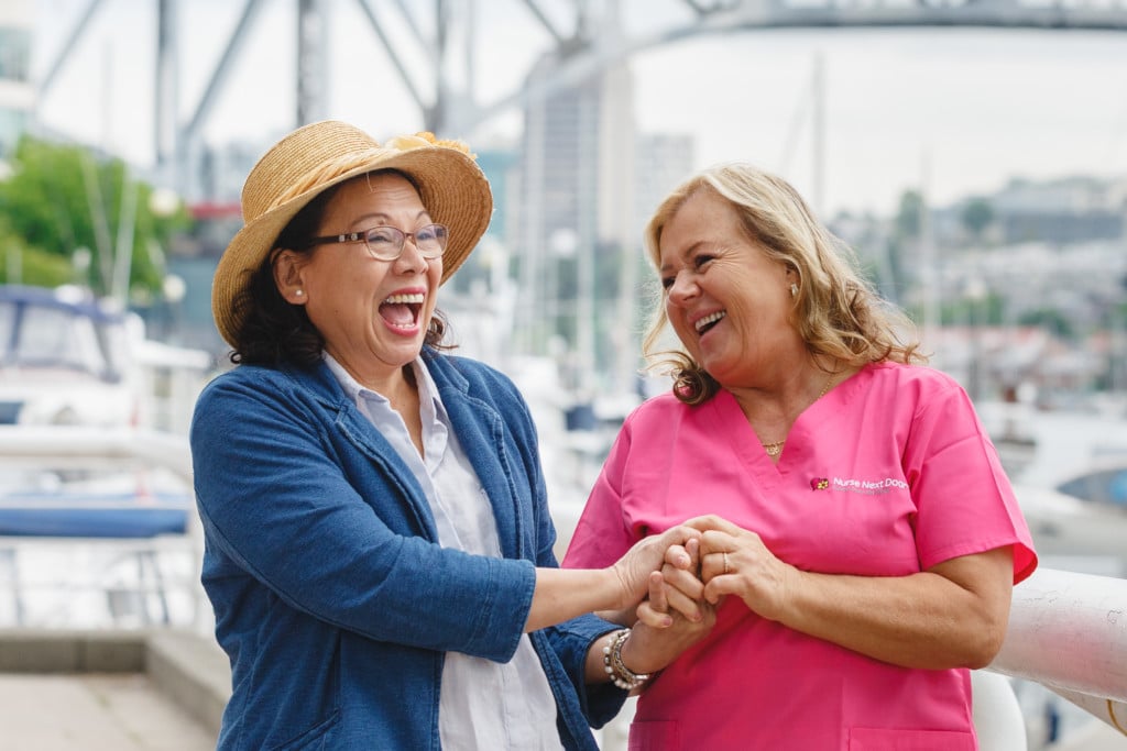 Caregiver and Client laughing together