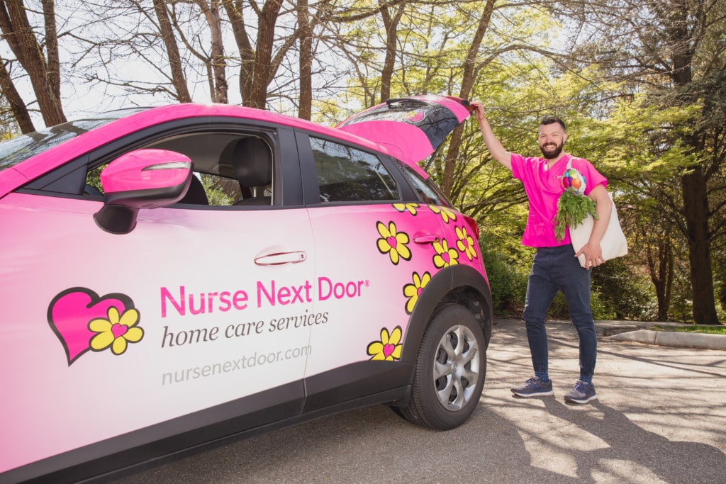 Caregiver delivering Groceries with Nurse Next Door Car